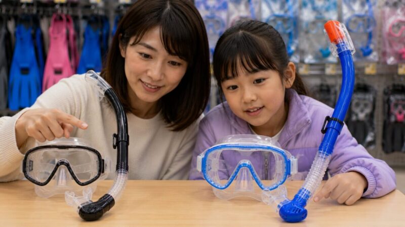 基本的なシュノーケルセットと排水機能付きセットを比較する親子